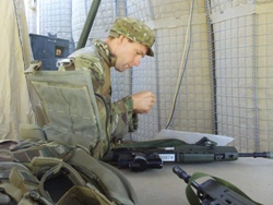 Environment Agency Officer Richard Hull Cleaning his Rifle at a Forward Operating Base.